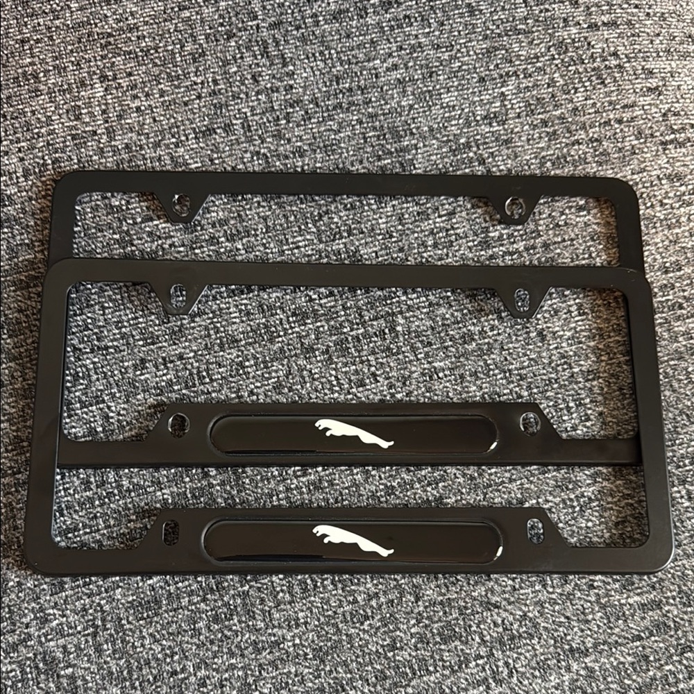 Two Jaguar license plate covers